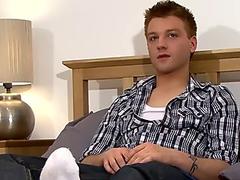 British twink tugs on his massive cock after an interview